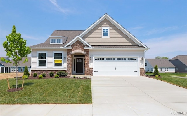 craftsman inspired home featuring stone siding, a front yard, and driveway
