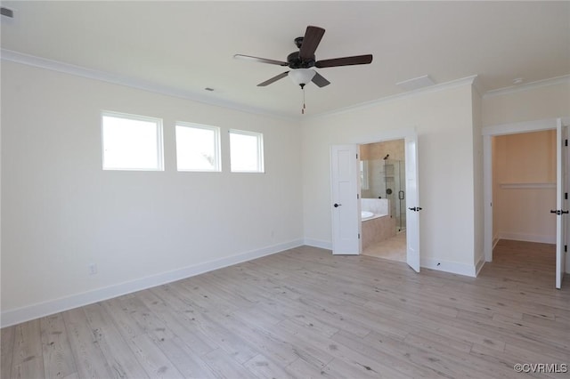 unfurnished bedroom with crown molding, light wood-style floors, baseboards, and ensuite bathroom