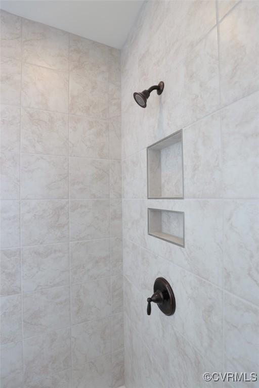 bathroom view of tiled shower