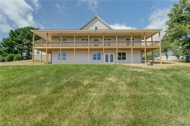 rear view of property with a lawn