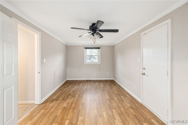 empty room with ceiling fan, ornamental molding, and light hardwood / wood-style flooring