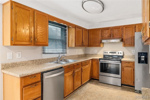 kitchen with sink and appliances with stainless steel finishes