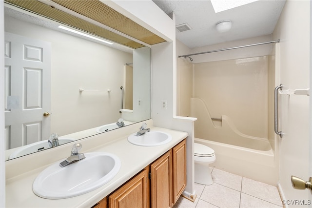 full bathroom featuring tile patterned flooring, vanity, shower / bath combination, and toilet