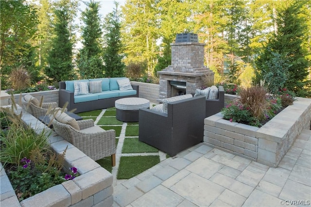 view of patio / terrace featuring an outdoor living space with a fireplace