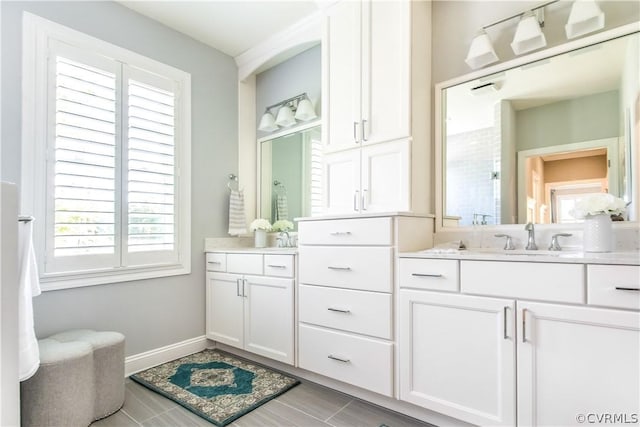 bathroom with plenty of natural light and vanity