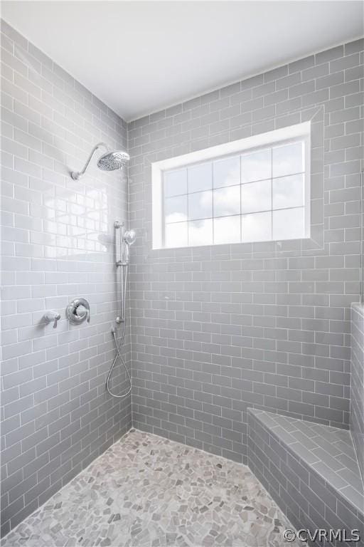 bathroom featuring tiled shower