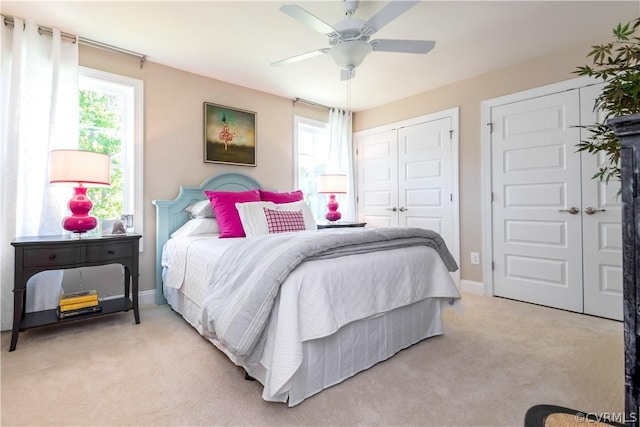 carpeted bedroom featuring ceiling fan