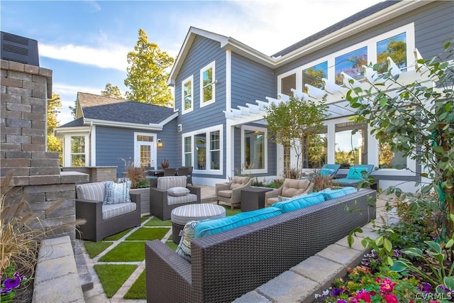 exterior space with a pergola and an outdoor hangout area