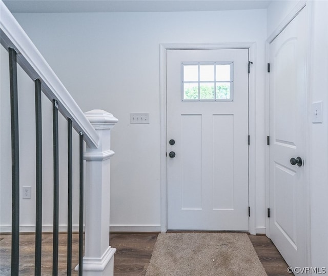 entryway with dark hardwood / wood-style floors