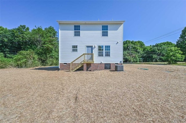 rear view of property featuring central air condition unit