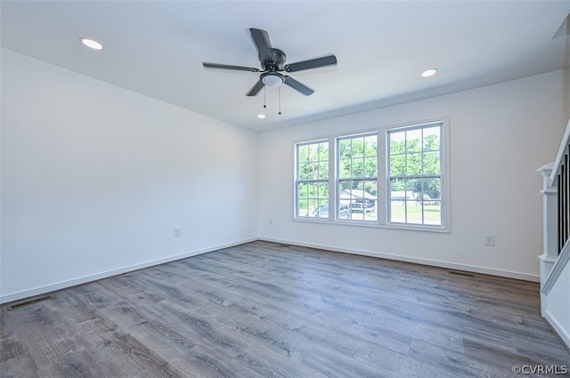 unfurnished room featuring hardwood / wood-style floors and ceiling fan