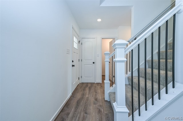 hallway with dark wood-type flooring