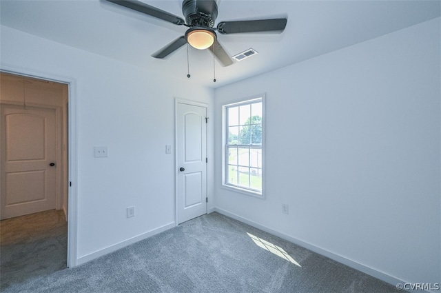 unfurnished bedroom featuring ceiling fan and carpet floors