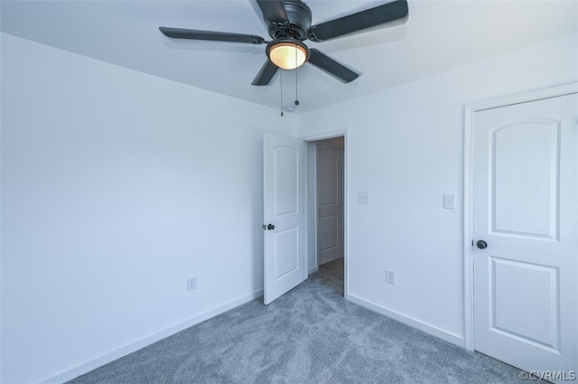 unfurnished bedroom featuring ceiling fan and light carpet