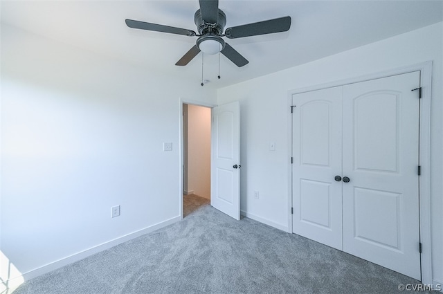 unfurnished bedroom featuring ceiling fan, carpet floors, and a closet