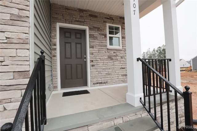 entrance to property with a porch