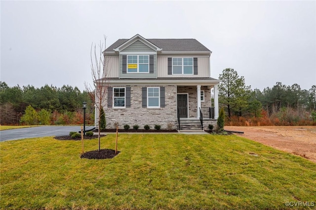 craftsman-style home with a front lawn