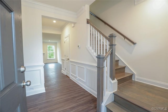 stairs with crown molding and hardwood / wood-style flooring