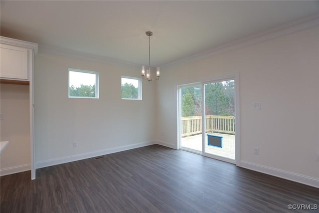 unfurnished dining area with ornamental molding, an inviting chandelier, a wealth of natural light, and dark wood-type flooring