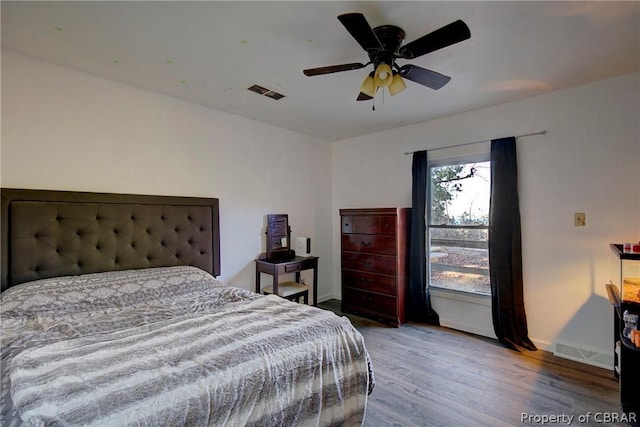 bedroom featuring wood-type flooring and ceiling fan