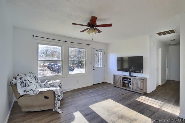 unfurnished room featuring ceiling fan and dark wood-type flooring