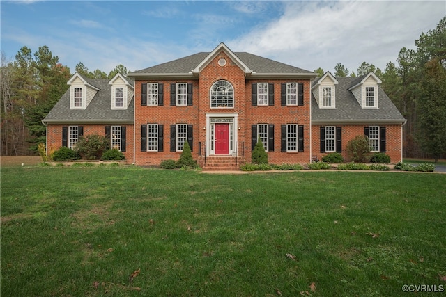 colonial-style house with a front lawn