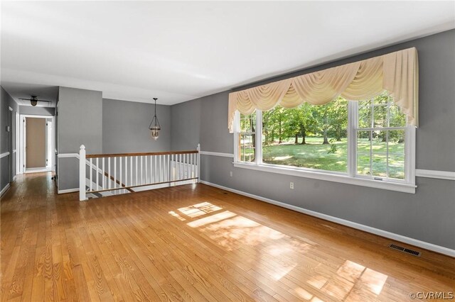 spare room featuring hardwood / wood-style floors