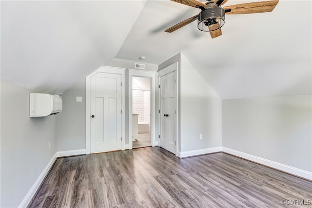 additional living space with vaulted ceiling, ceiling fan, and hardwood / wood-style flooring