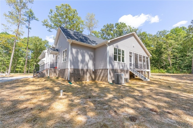 view of side of home featuring cooling unit