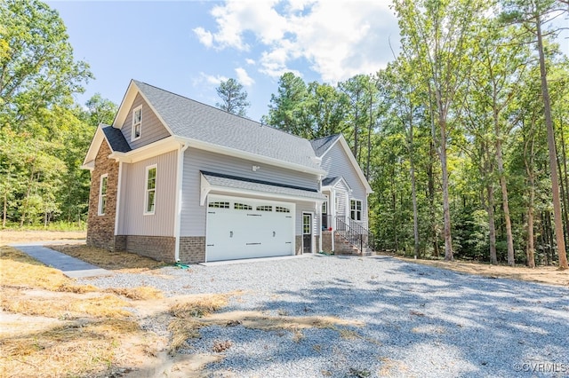 view of side of property with a garage