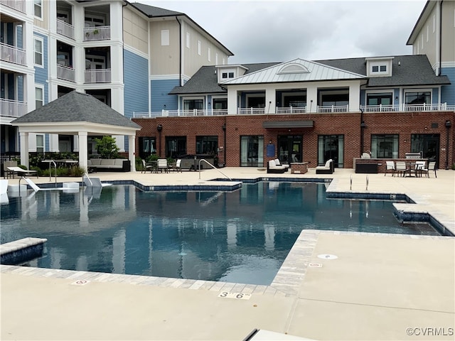 view of swimming pool featuring a patio