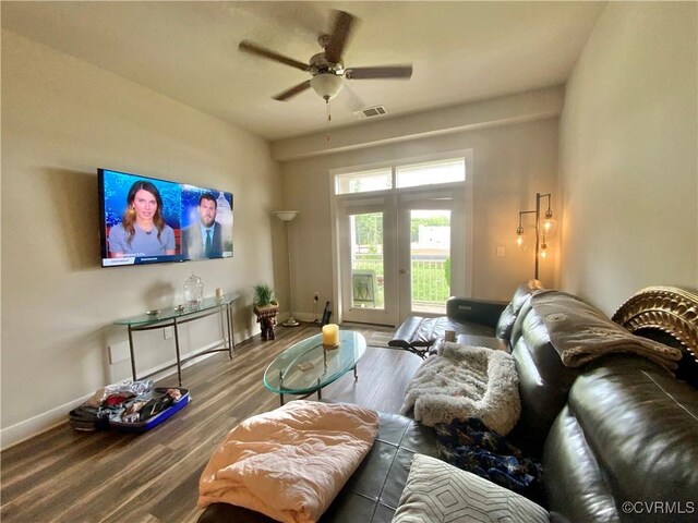 living room featuring wood-type flooring, french doors, and ceiling fan