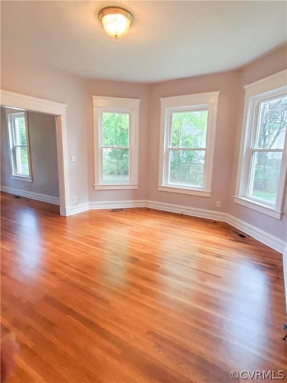 unfurnished room with light hardwood / wood-style flooring