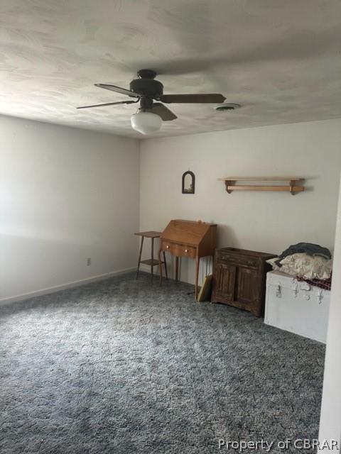 carpeted empty room with ceiling fan