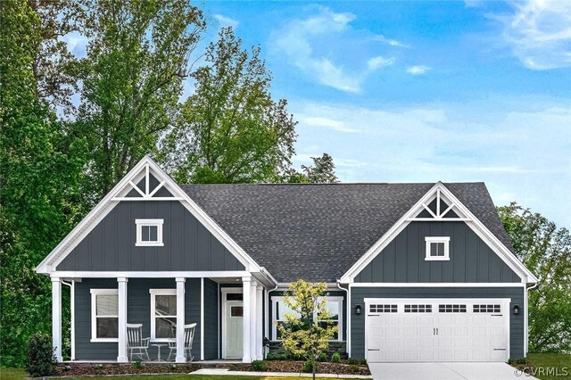 craftsman house featuring a porch and a garage