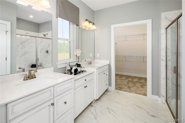 bathroom with dual vanity, walk in shower, and tile patterned floors