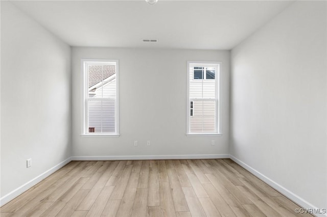 unfurnished room featuring light hardwood / wood-style flooring