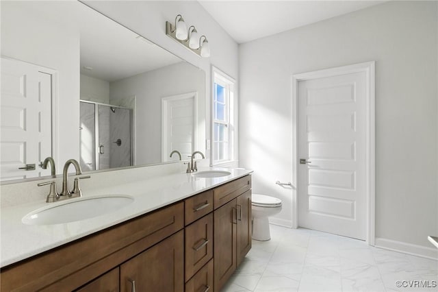 bathroom with vanity, toilet, and walk in shower