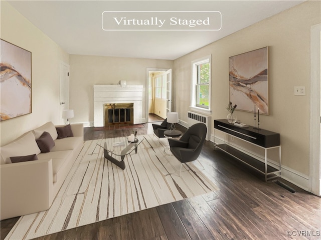 living room featuring radiator and hardwood / wood-style floors