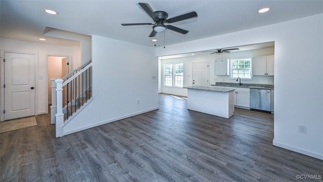 kitchen with ceiling fan, dishwasher, dark hardwood / wood-style floors, and white cabinetry