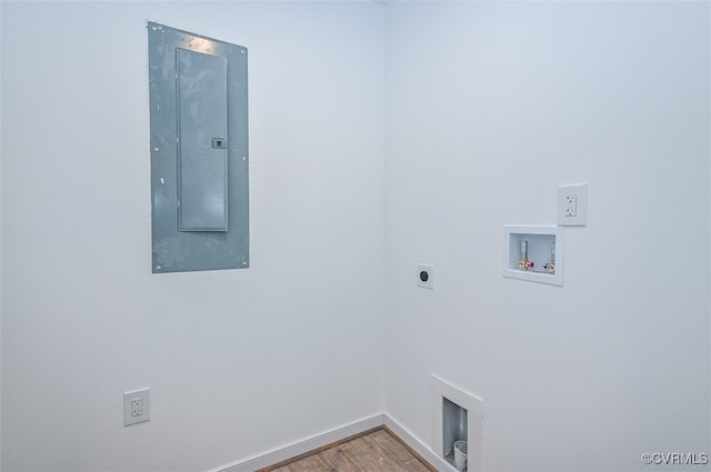 clothes washing area with washer hookup, electric panel, wood-type flooring, and electric dryer hookup