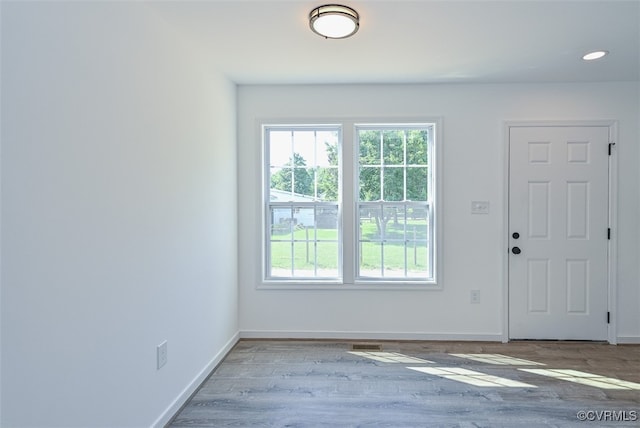 doorway to outside with hardwood / wood-style flooring