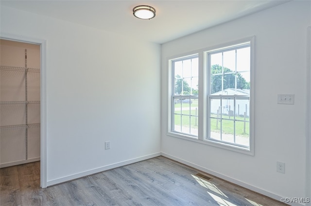 empty room with light wood-type flooring