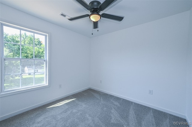 empty room featuring carpet floors and ceiling fan