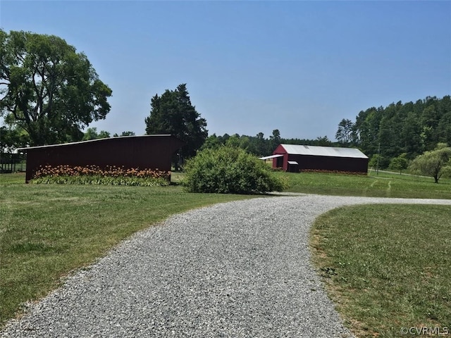 1501 Saxkey Rd, Drakes Branch, VA 23937 - view of property's community featuring a lawn, a pole building, gravel driveway, and an outdoor structure