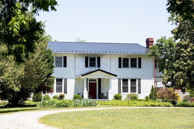 1501 Saxkey Rd, Drakes Branch, VA 23937 - colonial house with a chimney, metal roof, and a front lawn