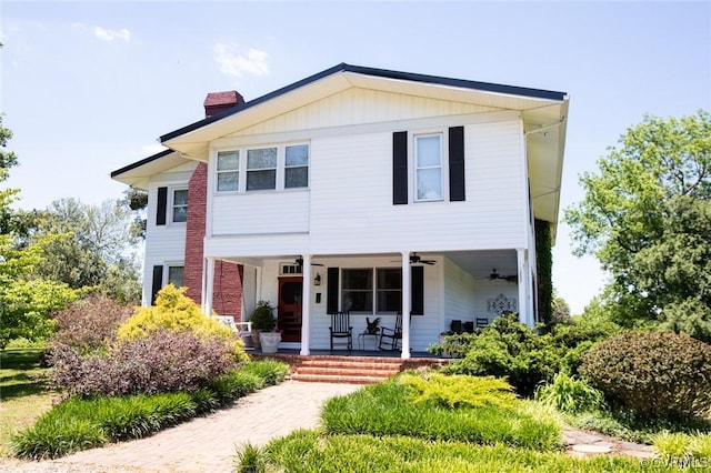 1501 Saxkey Rd, Drakes Branch, VA 23937 - view of front of home featuring a ceiling fan, covered porch, and a chimney