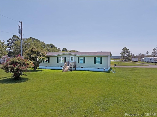 manufactured / mobile home featuring crawl space and a front lawn