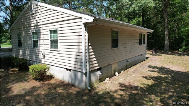 view of home's exterior with crawl space