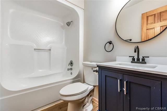 full bathroom featuring shower / tub combination, hardwood / wood-style floors, vanity, and toilet